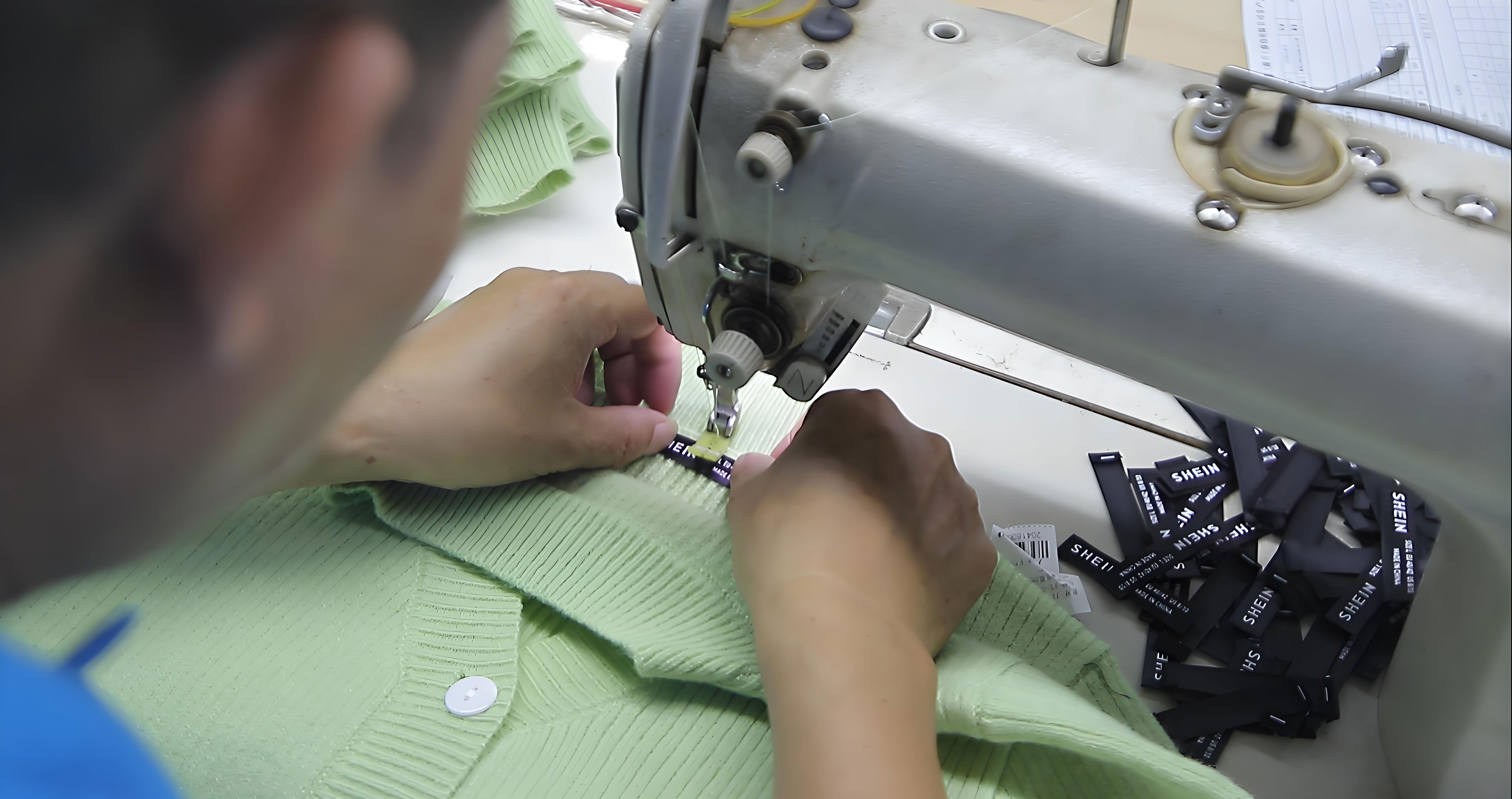 Custom brand label stitching by knitwear manufacturer